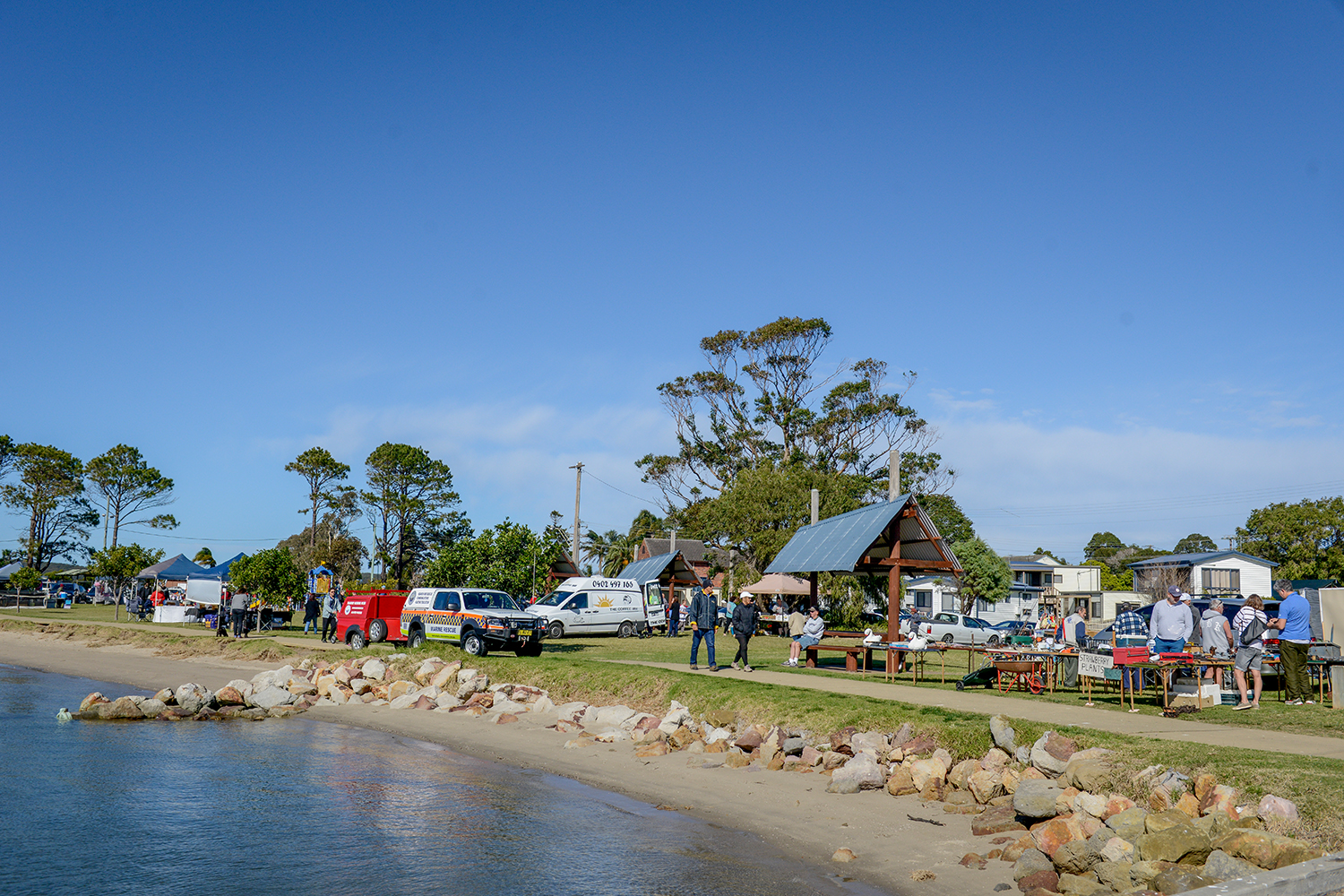 Community markets being held near the shorefront.