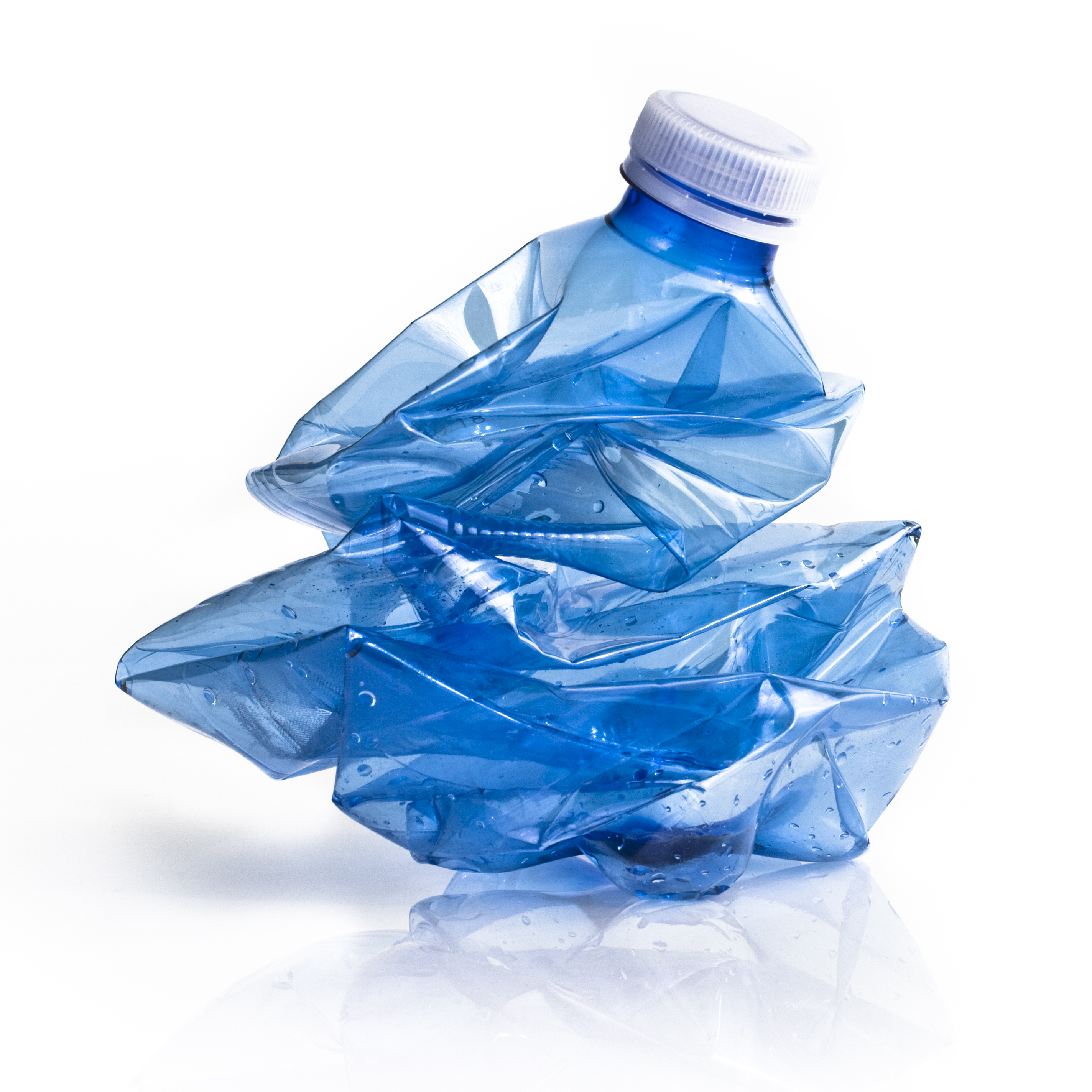 crushed plastic water bottle with lid on