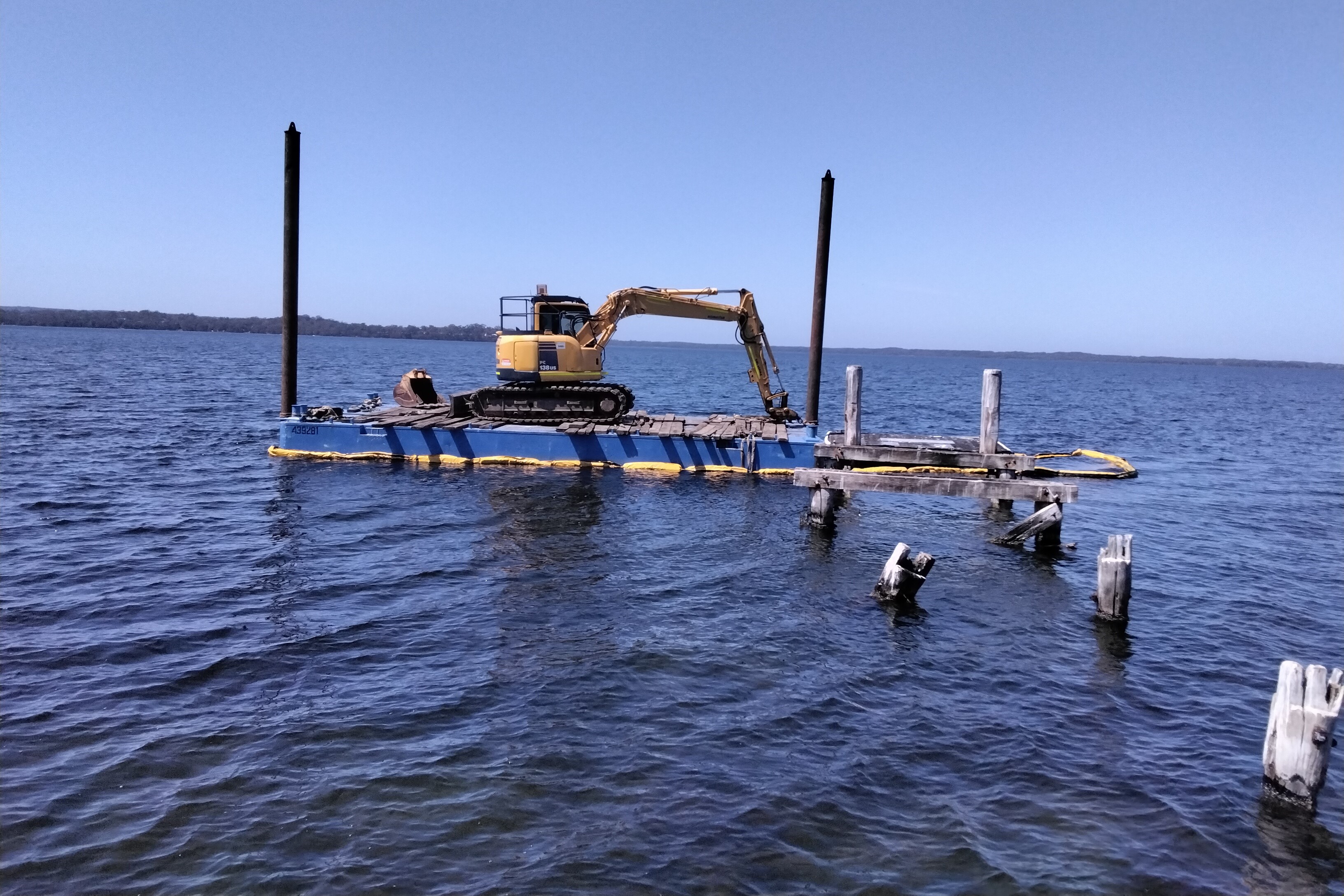 Crane on barge near damaged Island Point Rd jetty