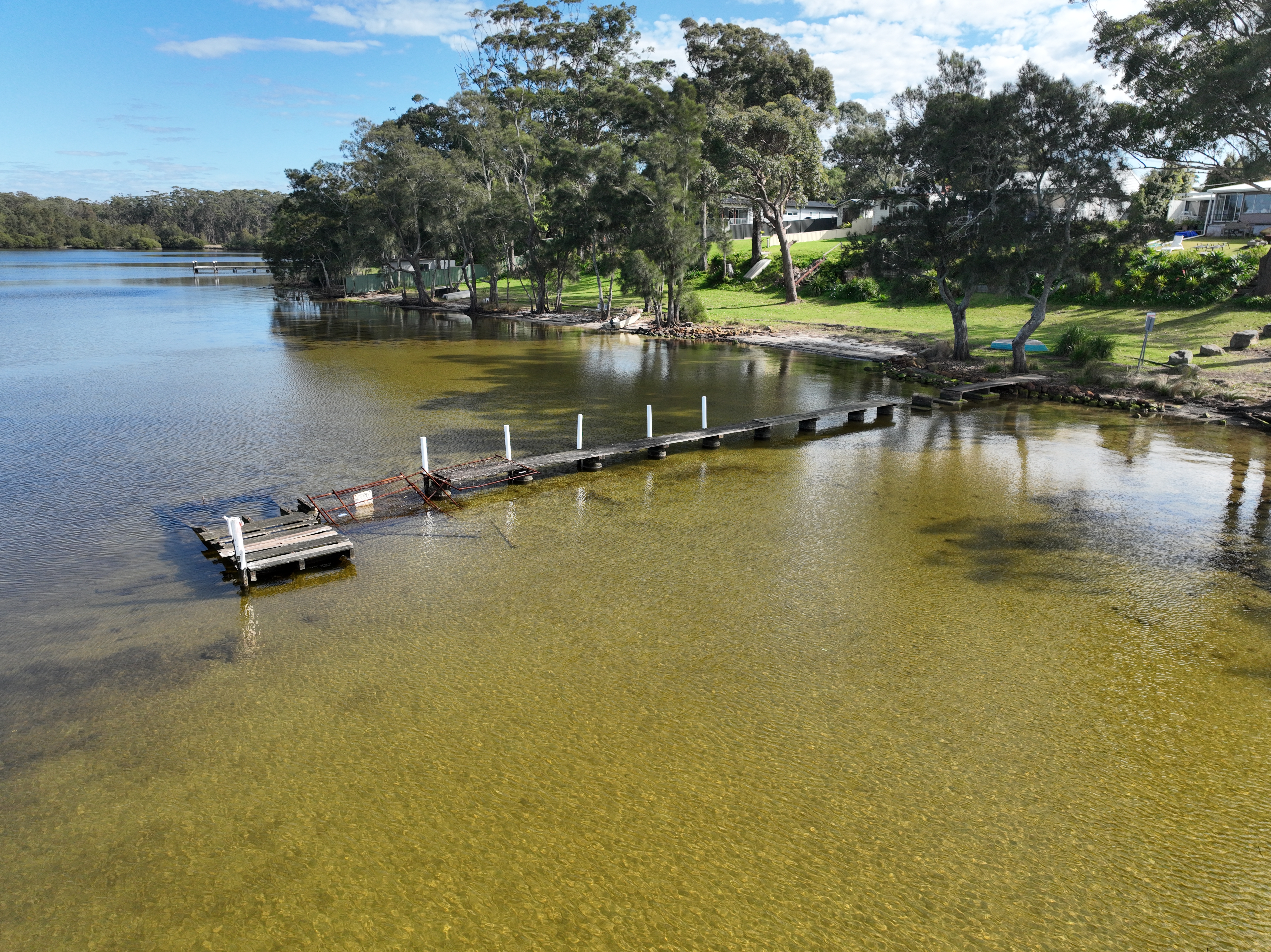 Long distance view of damaged jetty and water