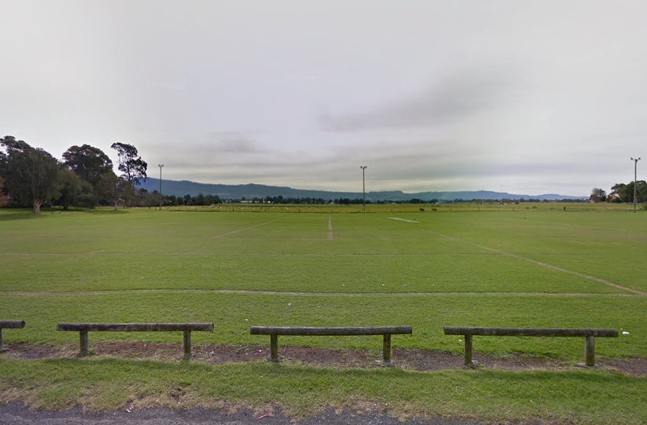 Street view of multiple sporting fields among suburban streets